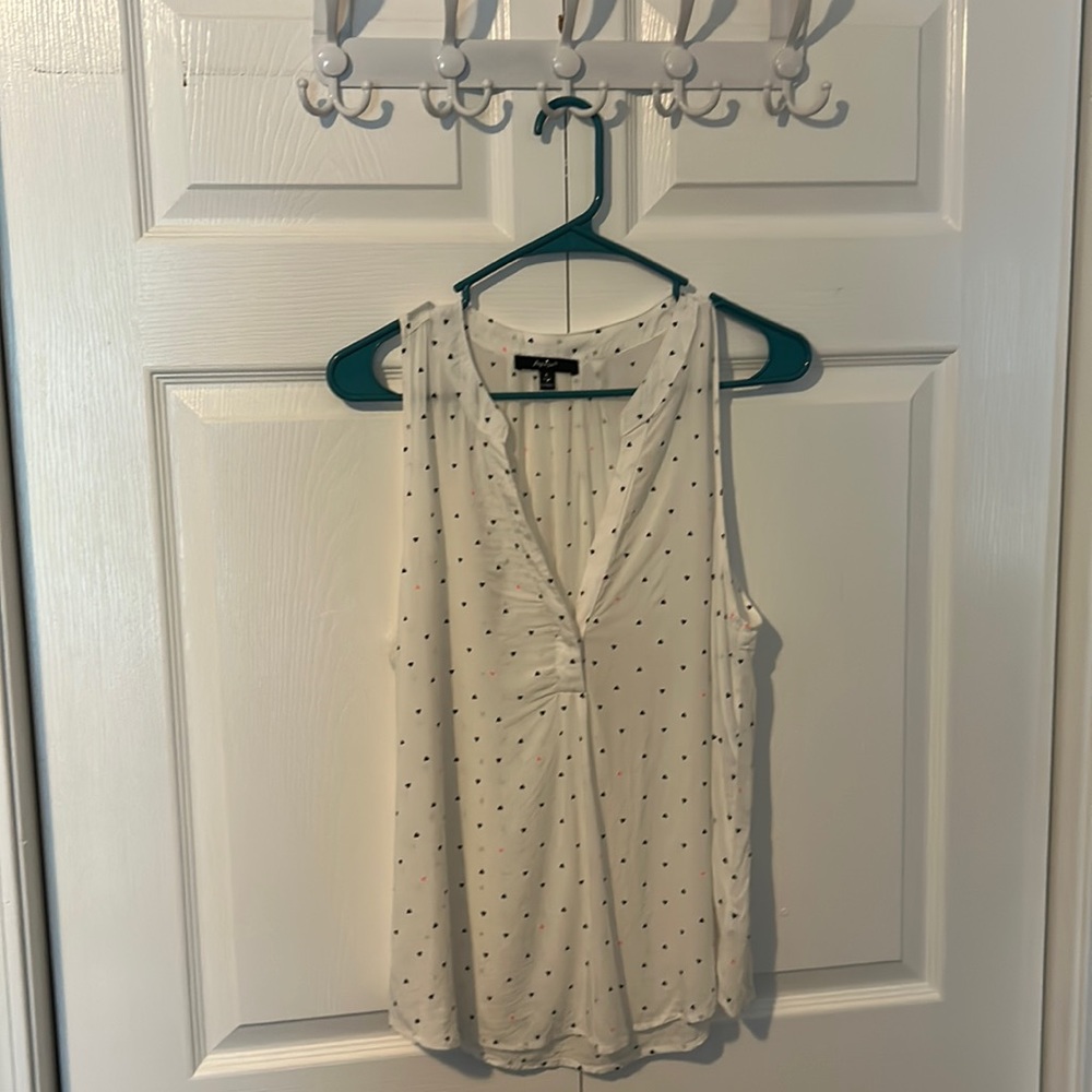 Sleeveless shirt.  White with small black and pink hearts.  Large